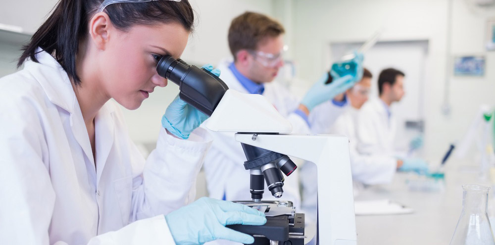 Team of lab techs in a lab setting