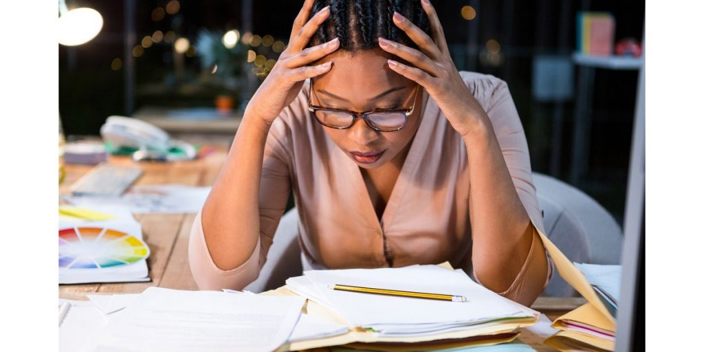 Stressed woman head in hands