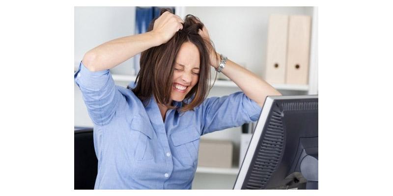 Stressed woman pulling her hair