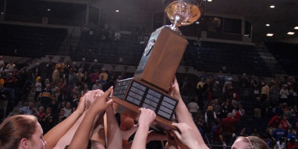 Team hands lifting trophy