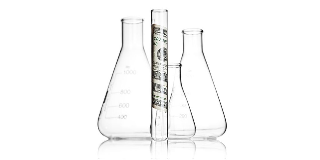 Lab beaker with money inside