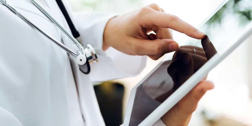 Doctor Using Digital Tablet