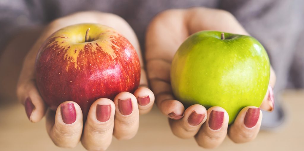 Hands holding apples